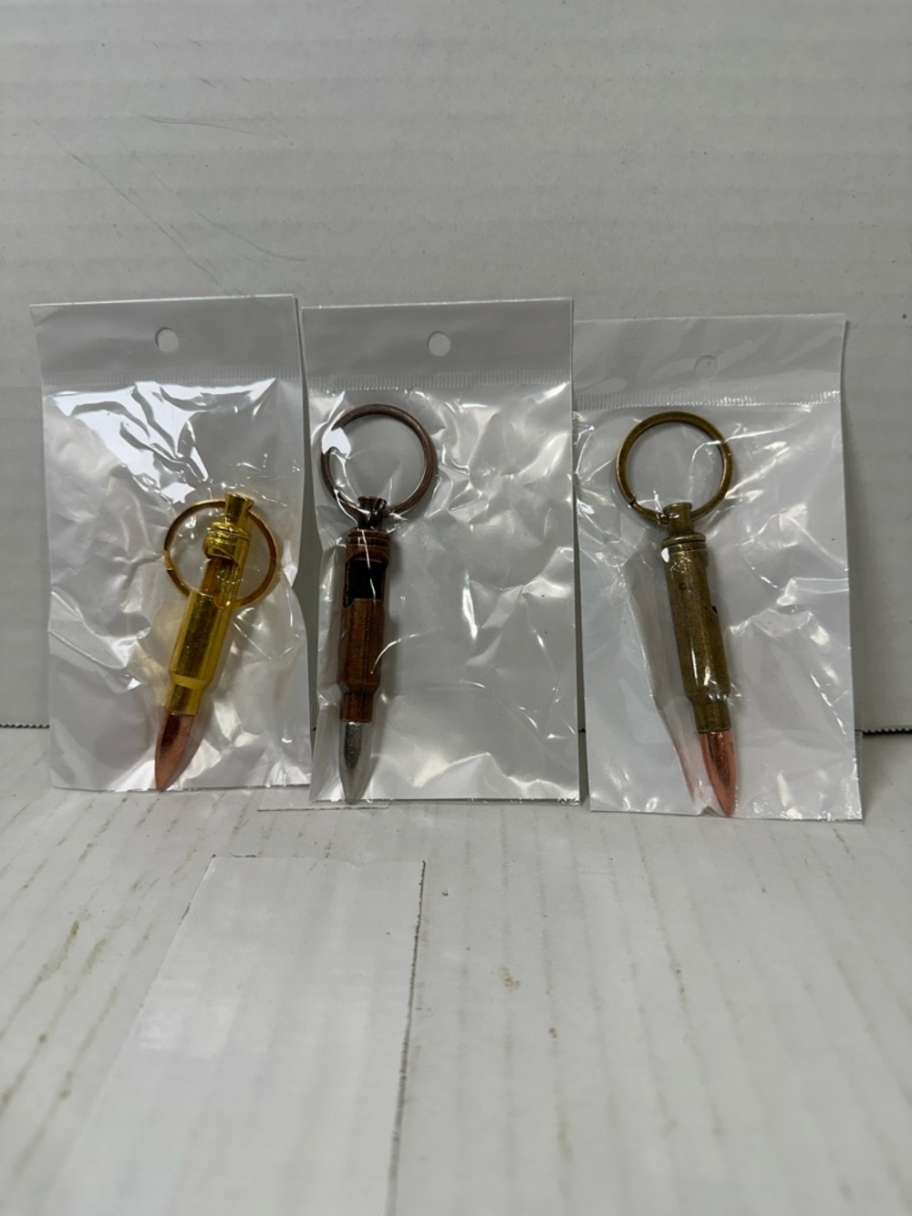 Metal Bullet Keychain - Gold w/silver bullet, copper, and brass sold as a set of